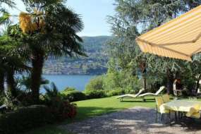 Ferienhaus mit Seeplatz, Motorboot, Wiese und Badesteg am Luganersee für 1 - 6 Personen (Nr. 129 - Ferienhaus Tessin)