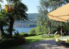 Ferienhaus mit Seeplatz, Motorboot, Wiese und Badesteg am Luganersee für 1 - 6 Personen (Nr. 129 - Ferienhaus Tessin)